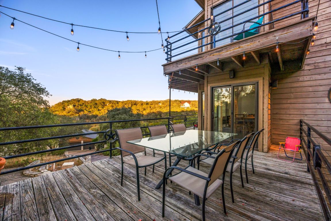 723 Coventry Road Spicewood, TX 78669 - Photo 27 of 40 a view of a chairs and table in the balcony