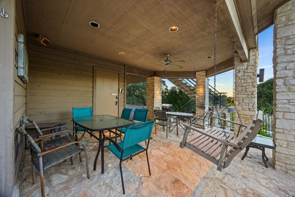 723 Coventry Road Spicewood, TX 78669 - Photo 33 of 40 a view of a patio with a table and chairs