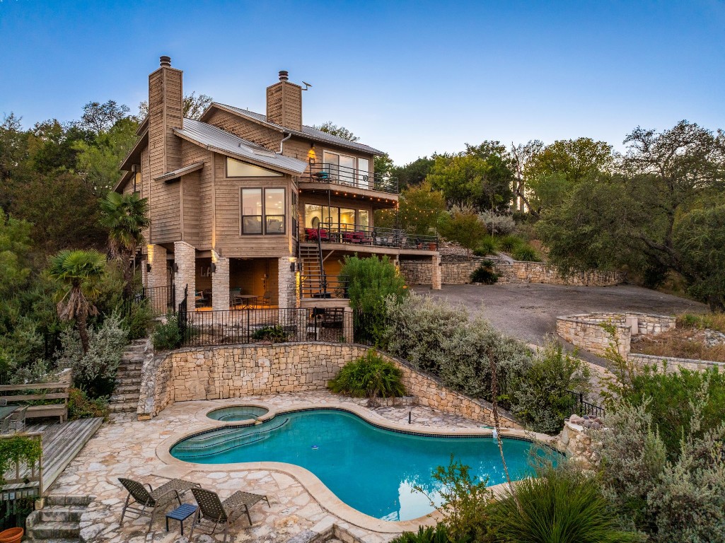 723 Coventry Road Spicewood, TX 78669 - Photo 35 of 40 a view of a house with a yard