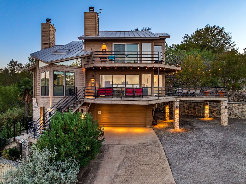 723 Coventry Road Spicewood, TX 78669 - Photo 36 of 40 a front view of a house with swimming pool