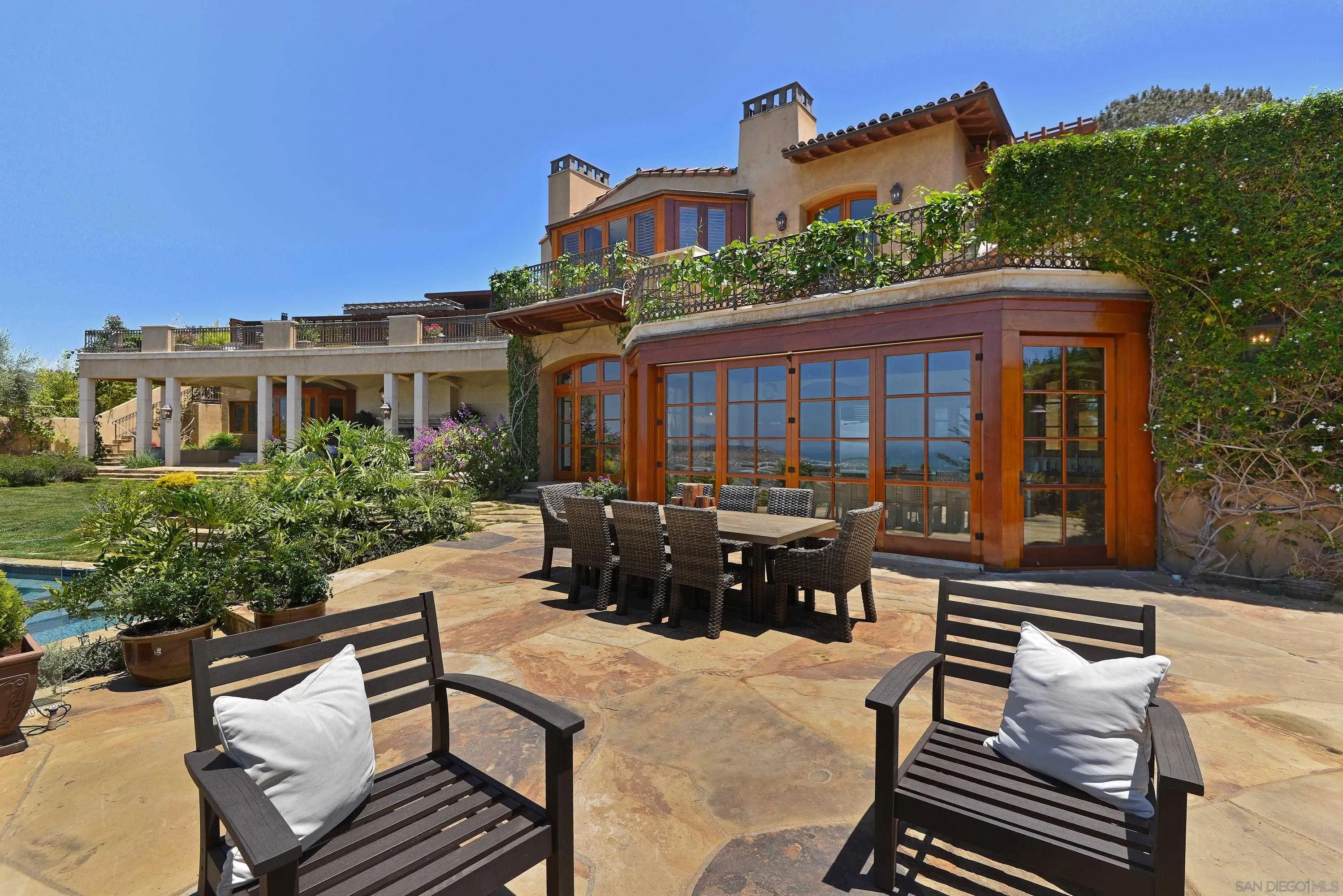 2116 Balboa Avenue Del Mar, CA 92014 - Photo 12 of 33 a view of a patio with couches table and chairs and potted plants