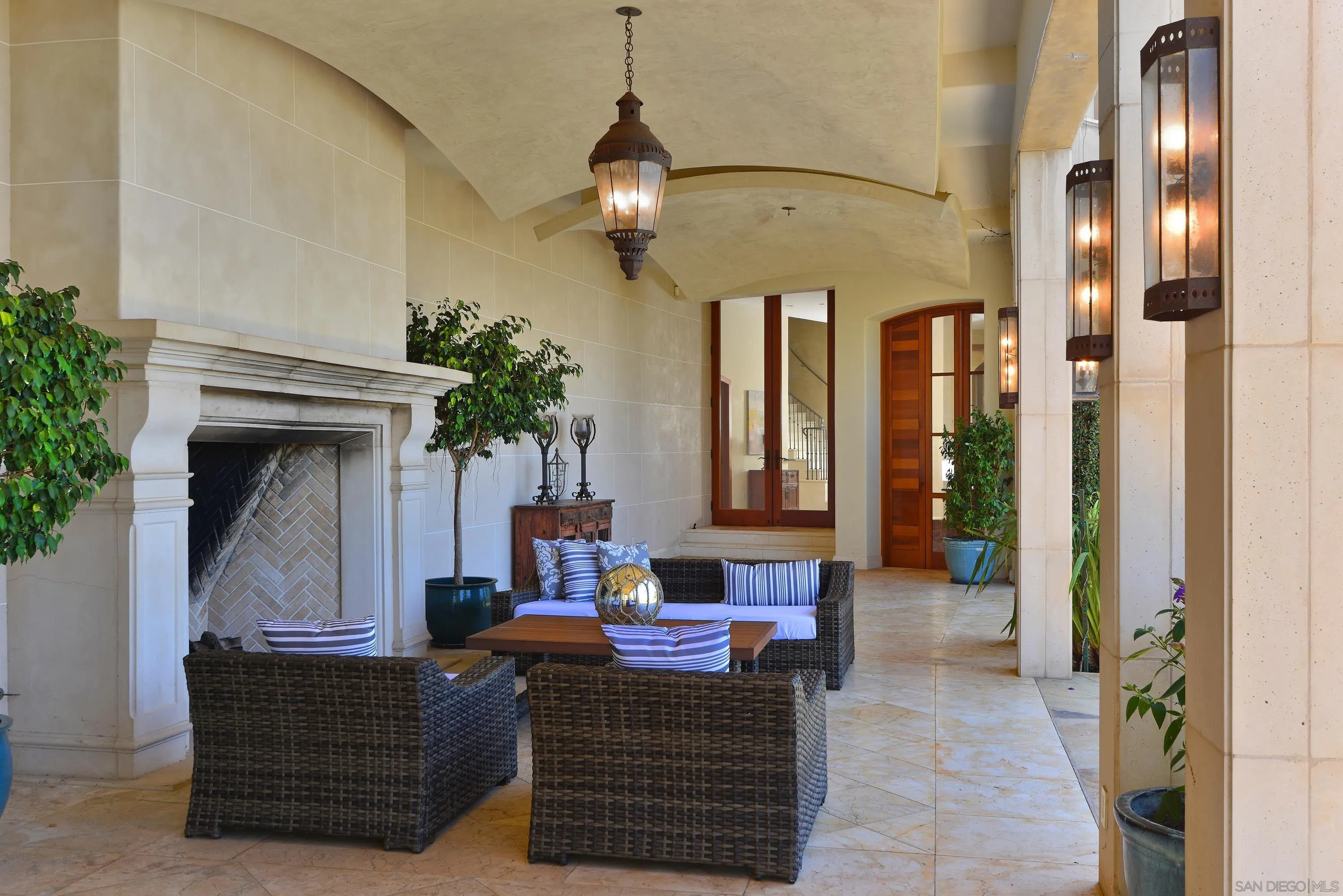 2116 Balboa Avenue Del Mar, CA 92014 - Photo 25 of 33 a living room with furniture a chandelier and a fireplace