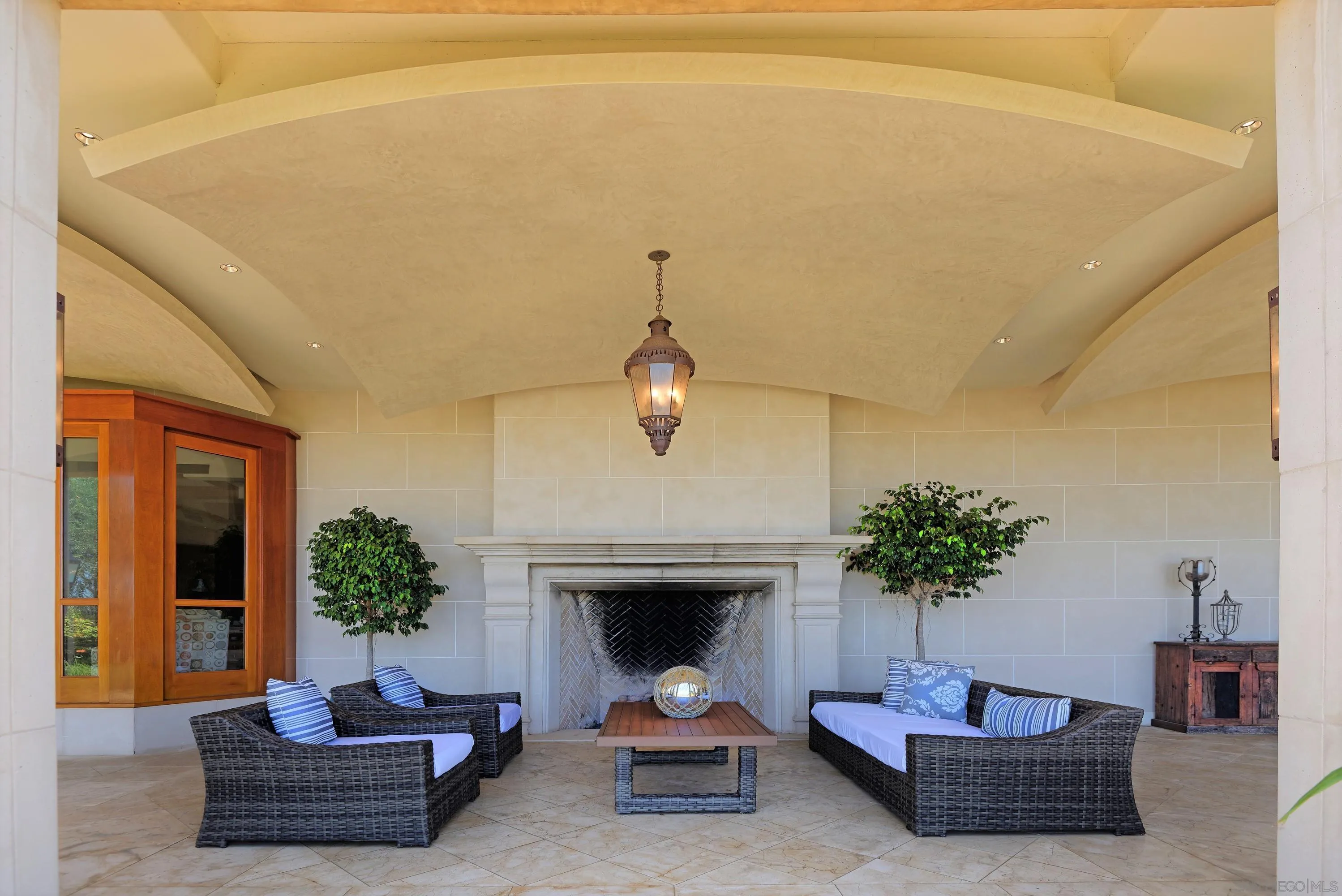 2116 Balboa Avenue Del Mar, CA 92014 - Photo 26 of 33 a living room with furniture potted plant and a fireplace