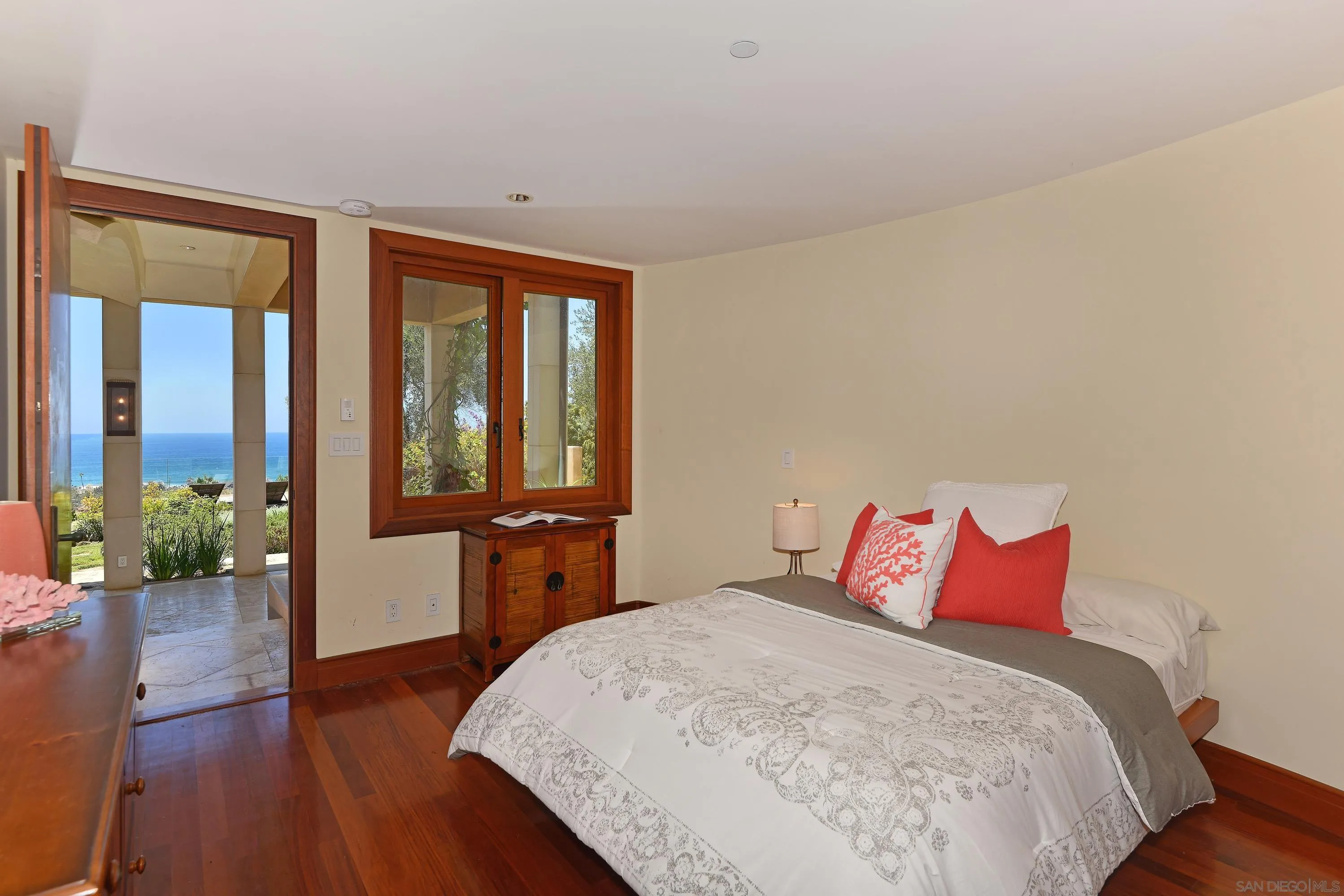 2116 Balboa Avenue Del Mar, CA 92014 - Photo 27 of 33 a bedroom with a large bed and wooden floor