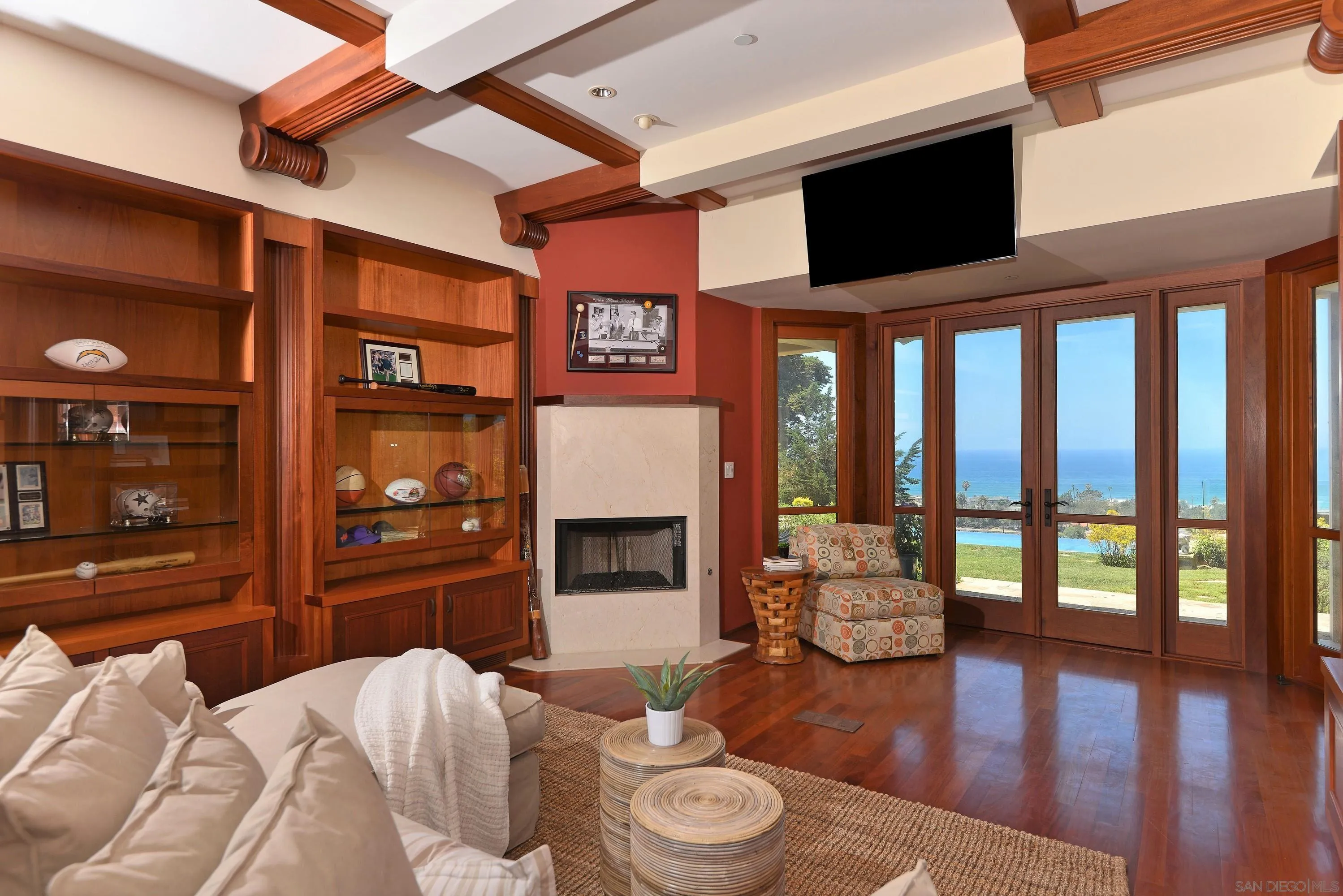 2116 Balboa Avenue Del Mar, CA 92014 - Photo 30 of 33 a living room with furniture a fireplace and a flat screen tv