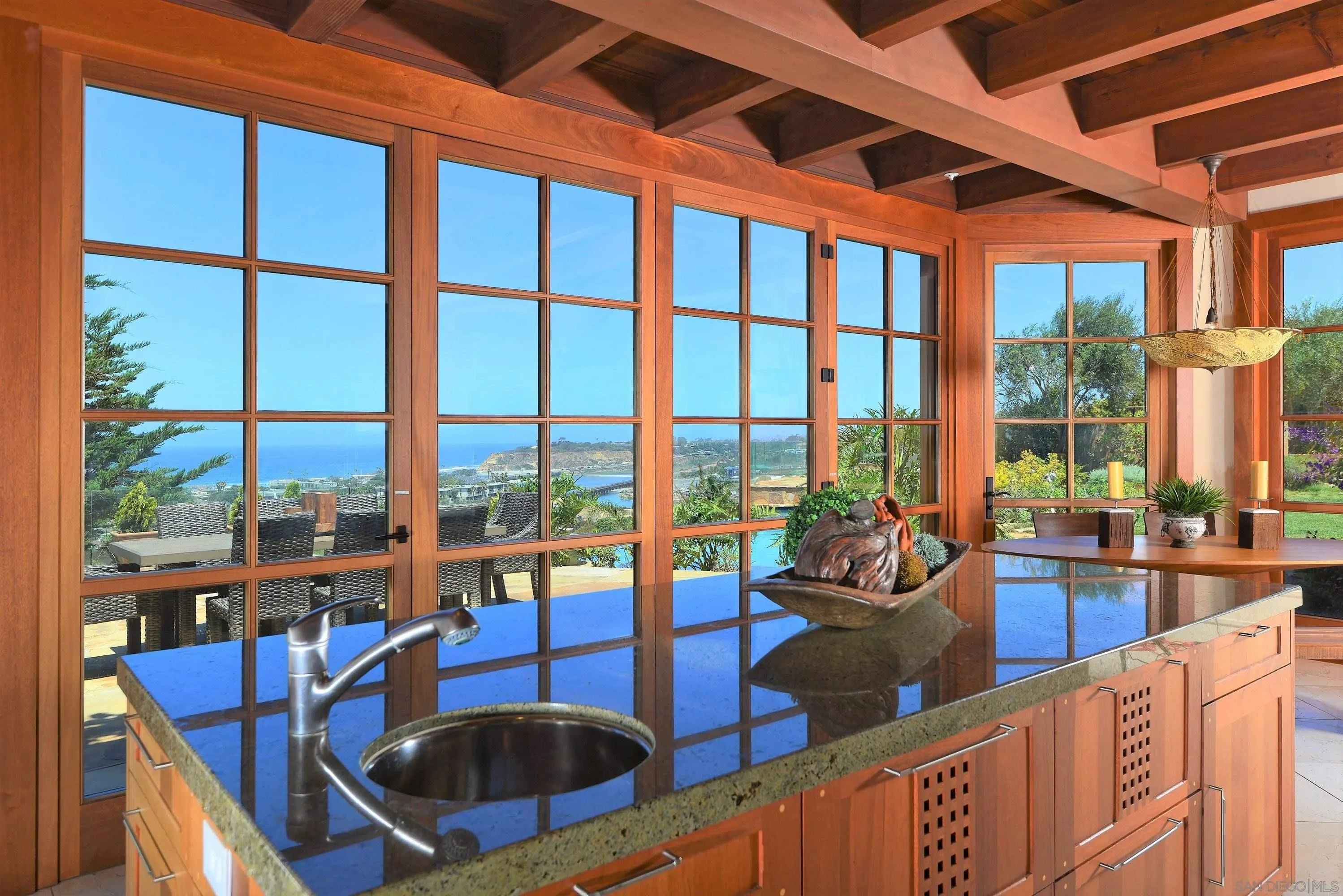 2116 Balboa Avenue Del Mar, CA 92014 - Photo 9 of 33 a view of a dining room with furniture large windows and wooden floor