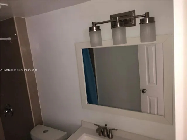 a bathroom with a sink and toilet