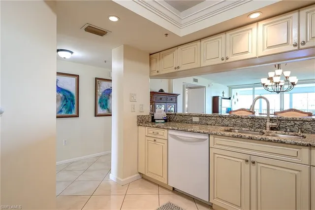 a bedroom with a large bed and a large window