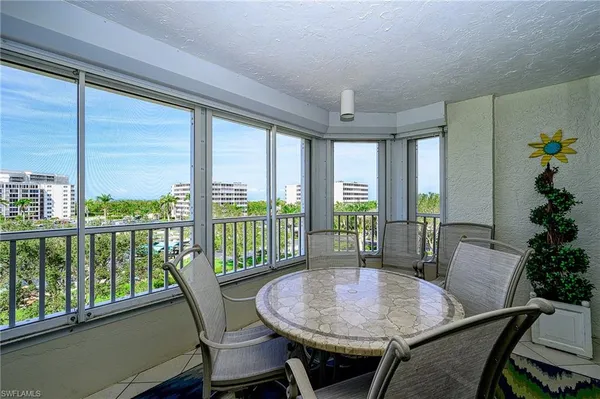 a view of a balcony with chairs