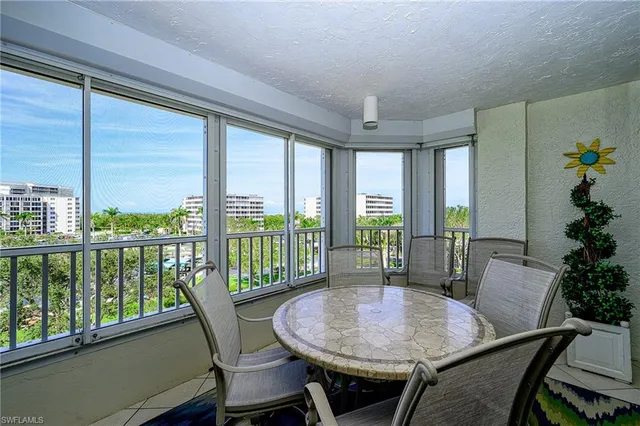 a view of a balcony with chairs