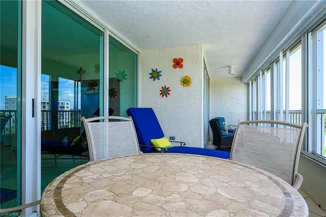 a tennis court with view of buildings in the background