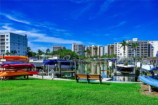 a view of a city with tall buildings and a big yard