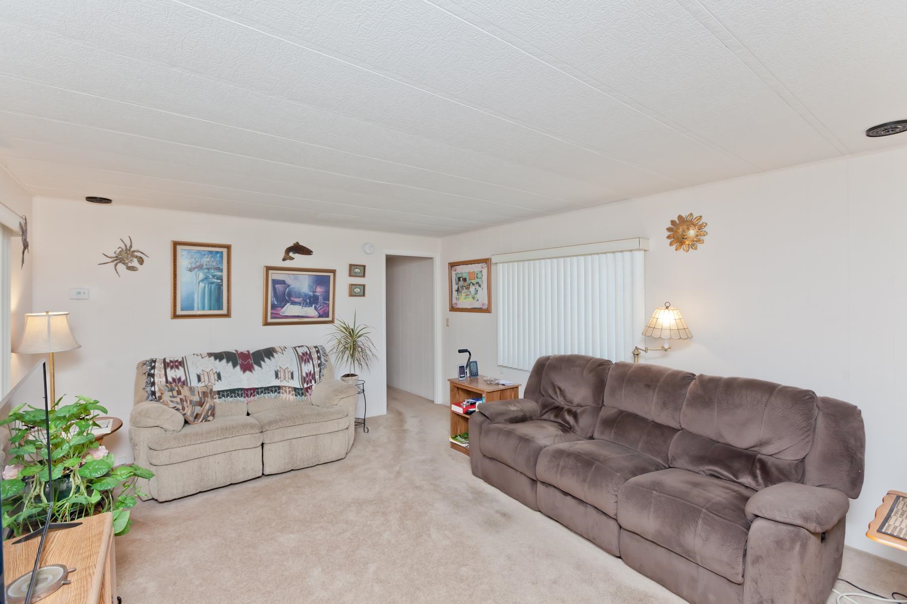 3251 E Road, Unit 20 Clifton, CO 81520 - Photo 15 of 26 a living room with furniture and a couch