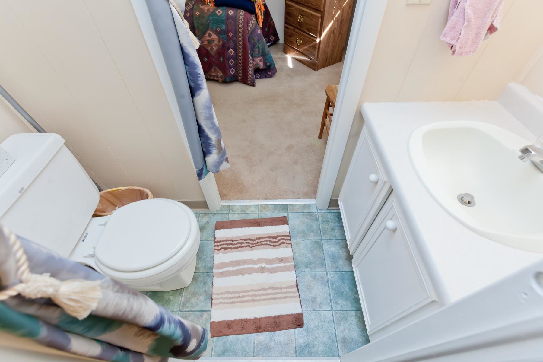 3251 E Road, Unit 20 Clifton, CO 81520 - Photo 19 of 26 a bathroom with a sink and toilet