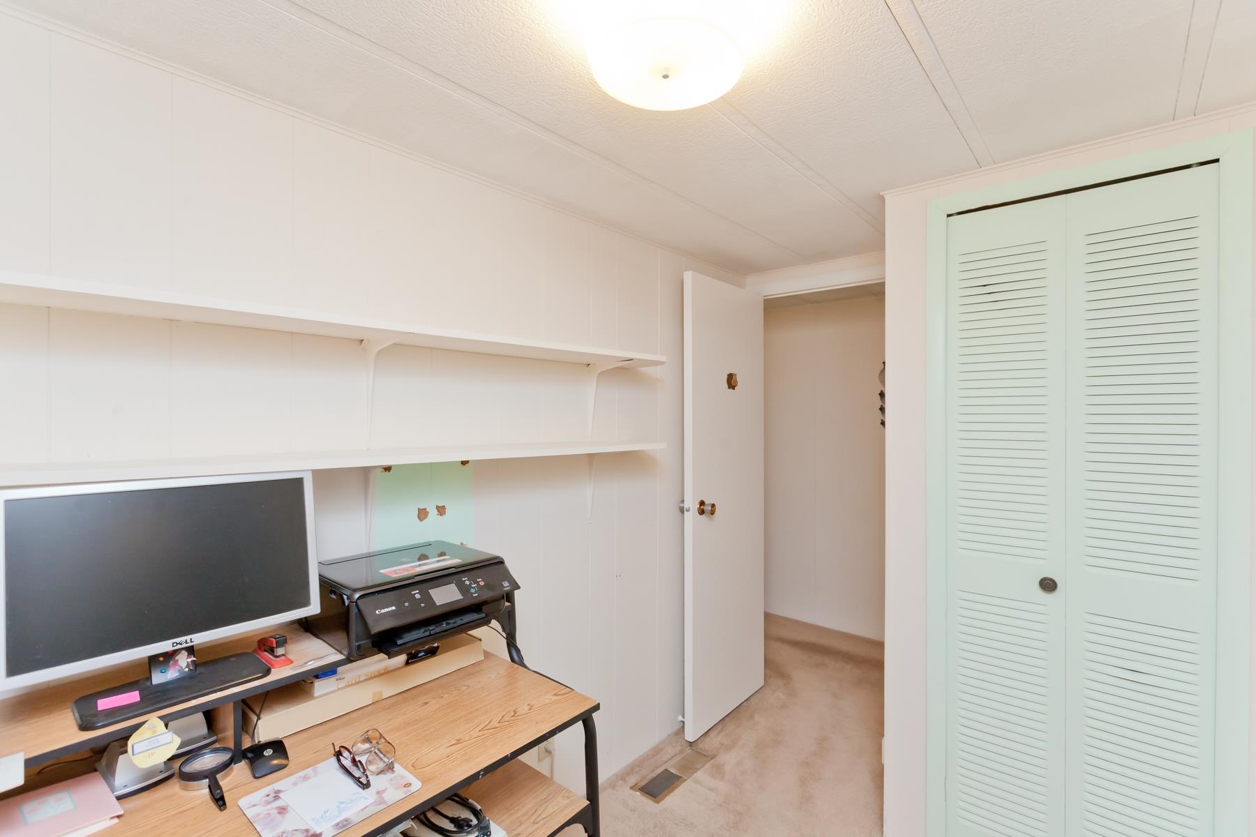 3251 E Road, Unit 20 Clifton, CO 81520 - Photo 20 of 26 a room with furniture and flat screen tv