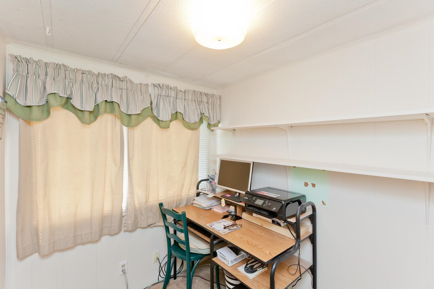 3251 E Road, Unit 20 Clifton, CO 81520 - Photo 21 of 26 a view of a workspace with furniture