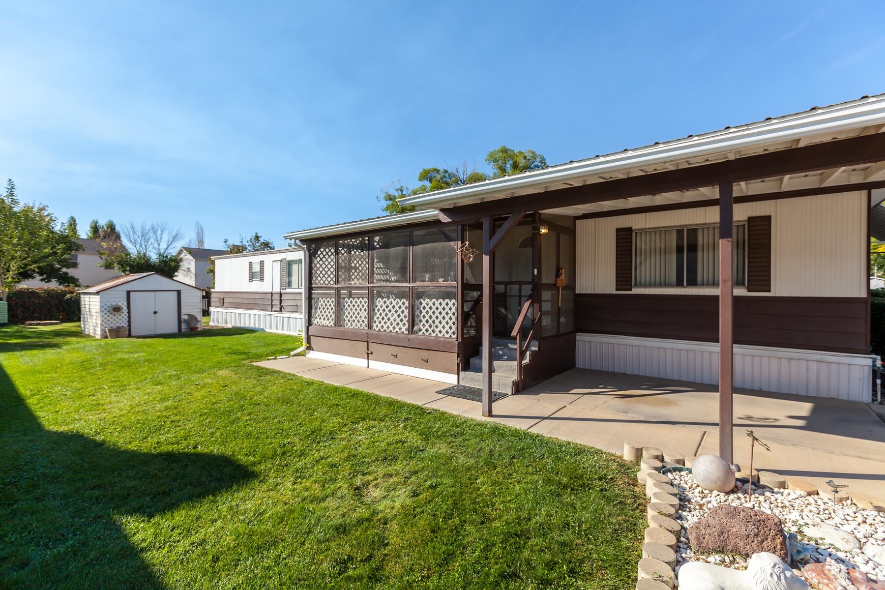3251 E Road, Unit 20 Clifton, CO 81520 - Photo 6 of 26 a view of backyard with large tree and wooden fence
