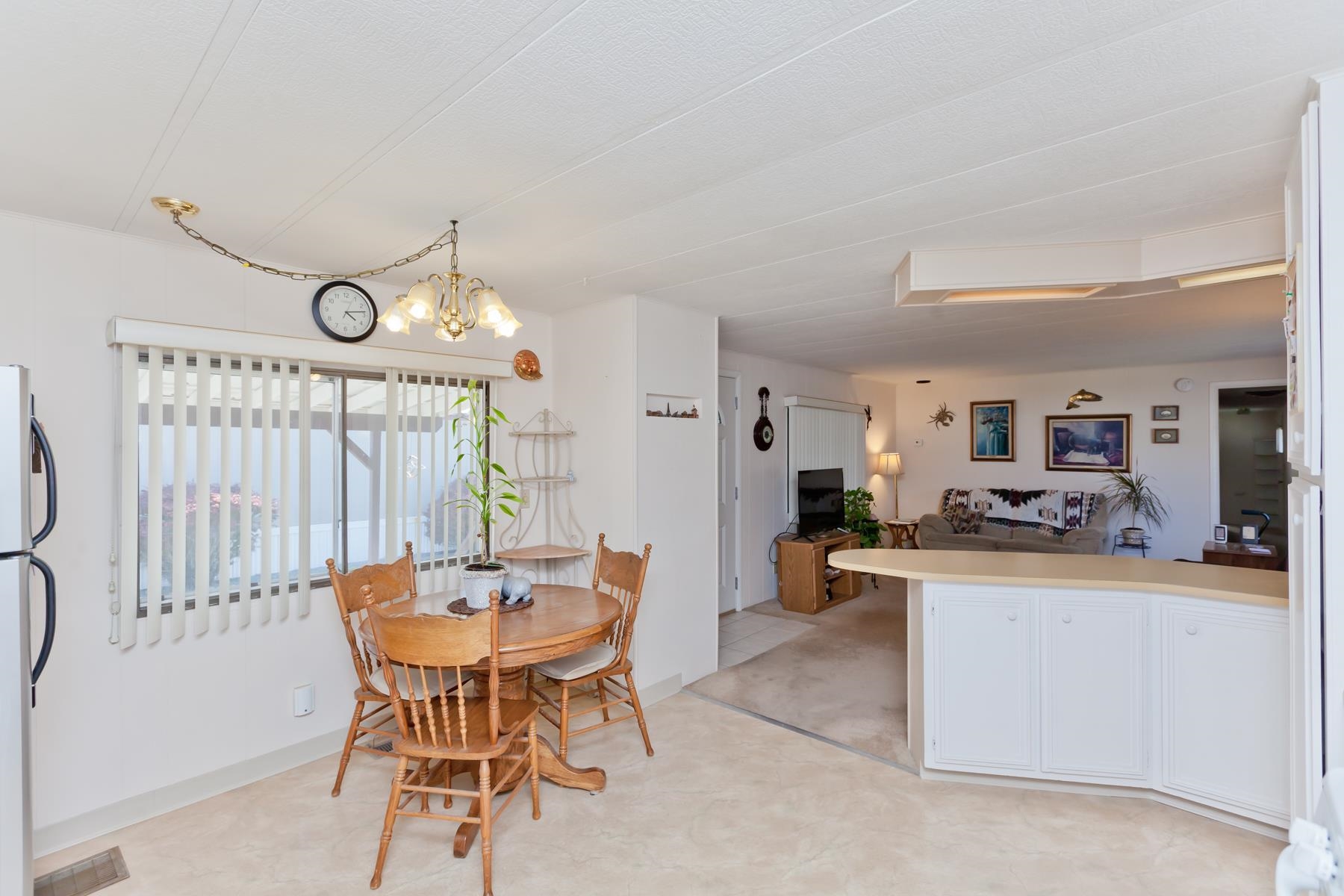 3251 E Road, Unit 20 Clifton, CO 81520 - Photo 9 of 26 a view of a dining room with furniture and a chandelier