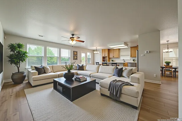 a living room with furniture and a large window