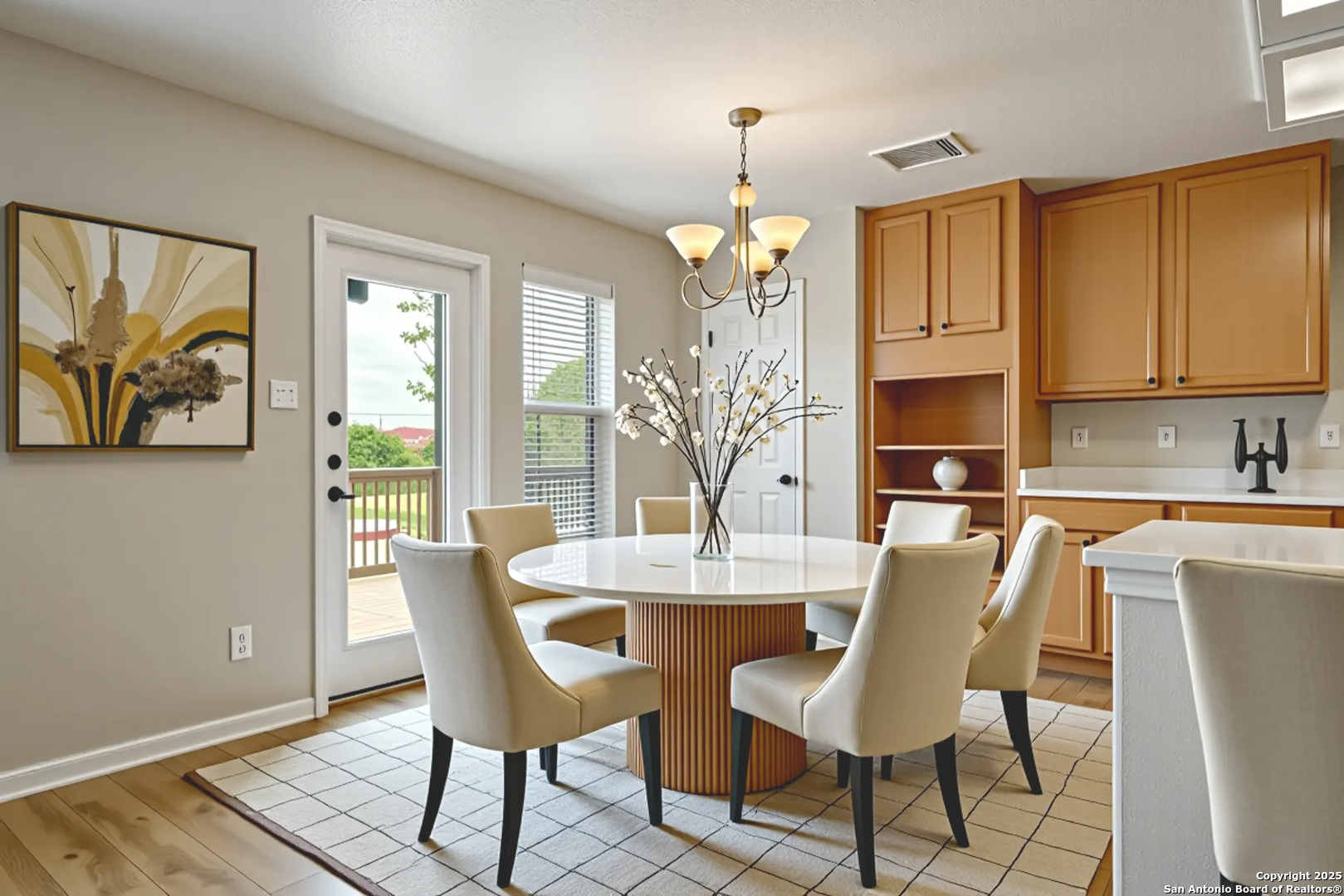 4731 Bending Grove San Antonio, TX 78259 - Photo 14 of 43 a view of a dining room with furniture wooden floor and a chandelier