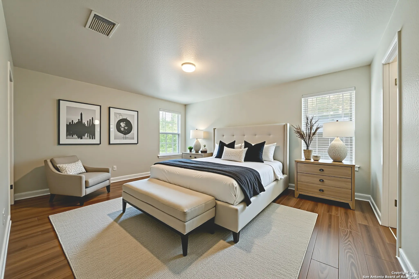 4731 Bending Grove San Antonio, TX 78259 - Photo 18 of 43 a bedroom with a bed and wooden floor