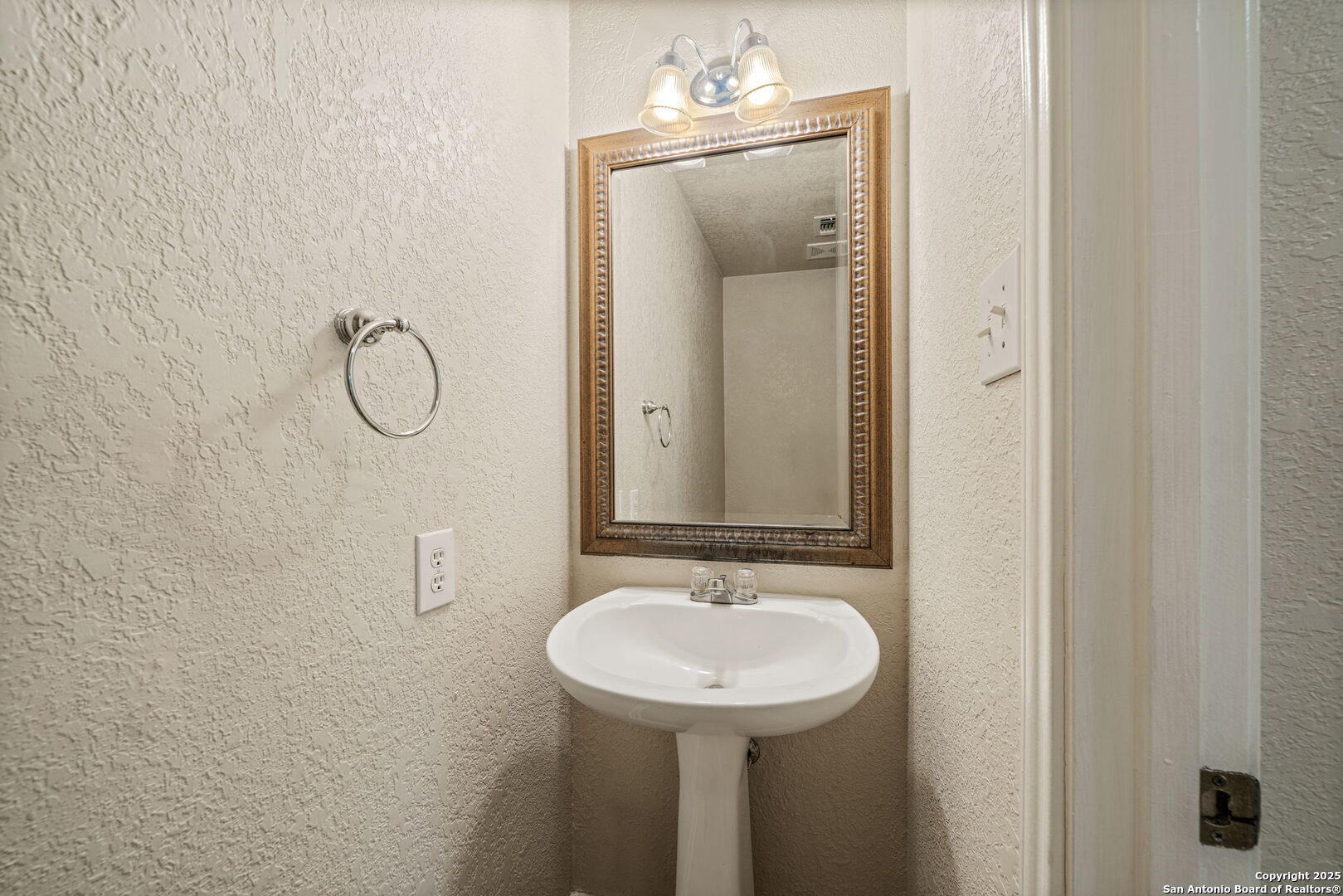 4731 Bending Grove San Antonio, TX 78259 - Photo 27 of 43 a bathroom with a sink and mirror