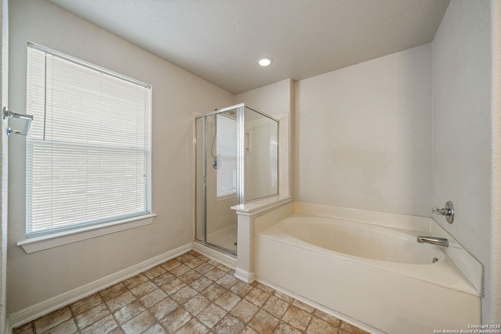 4731 Bending Grove San Antonio, TX 78259 - Photo 30 of 43 a bathroom with a bathtub and a shower