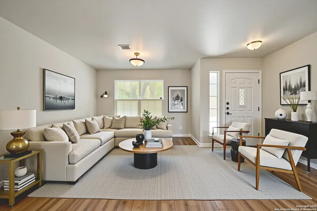a living room with furniture and a large window