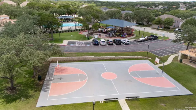 an aerial view of a house with a swimming pool