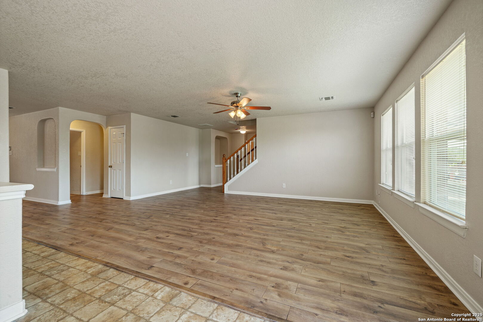 4731 Bending Grove San Antonio, TX 78259 - Photo 9 of 43 wooden floor in an empty room with a window
