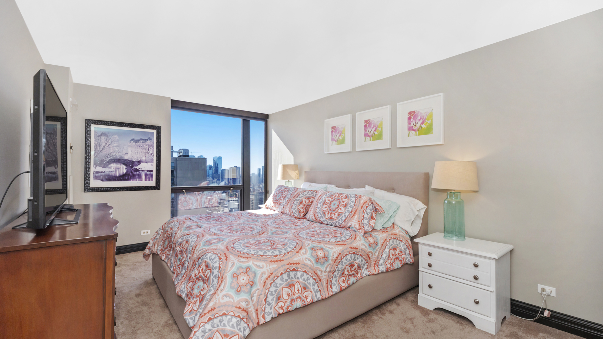 1122 North Clark Street, Unit 3808 Chicago, IL 60610 - Photo 14 of 29 a bedroom with a bed and a couch