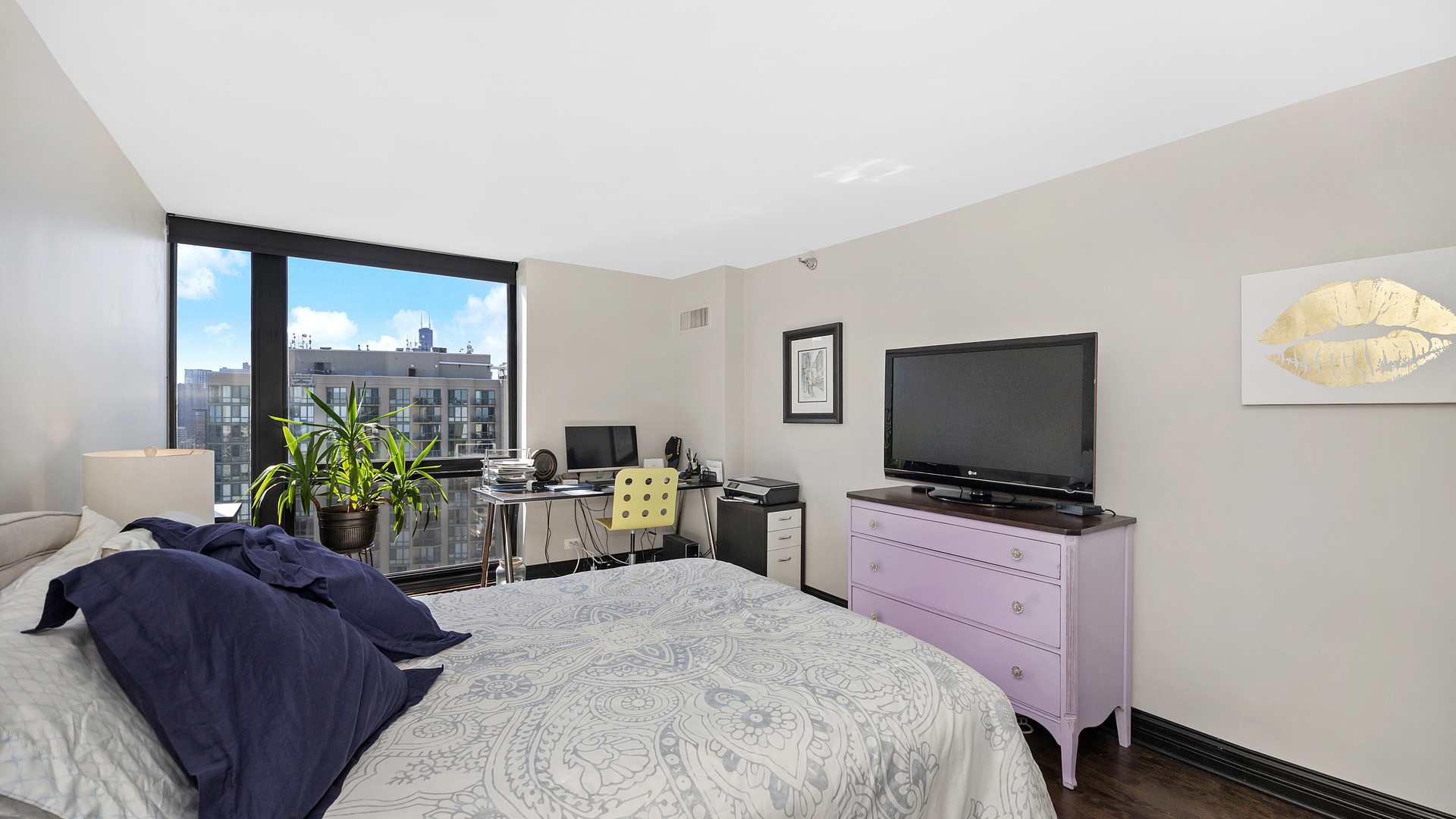 1122 North Clark Street, Unit 3808 Chicago, IL 60610 - Photo 20 of 29 a living room with furniture and a flat screen tv