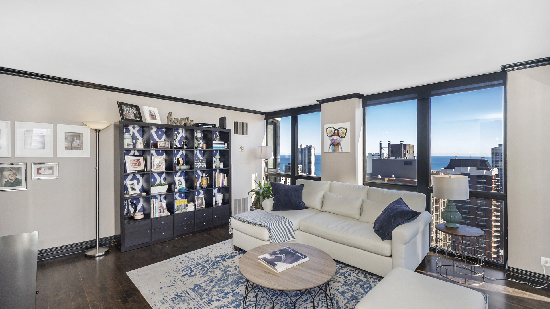 1122 North Clark Street, Unit 3808 Chicago, IL 60610 - Photo 5 of 29 a living room with furniture and a rug