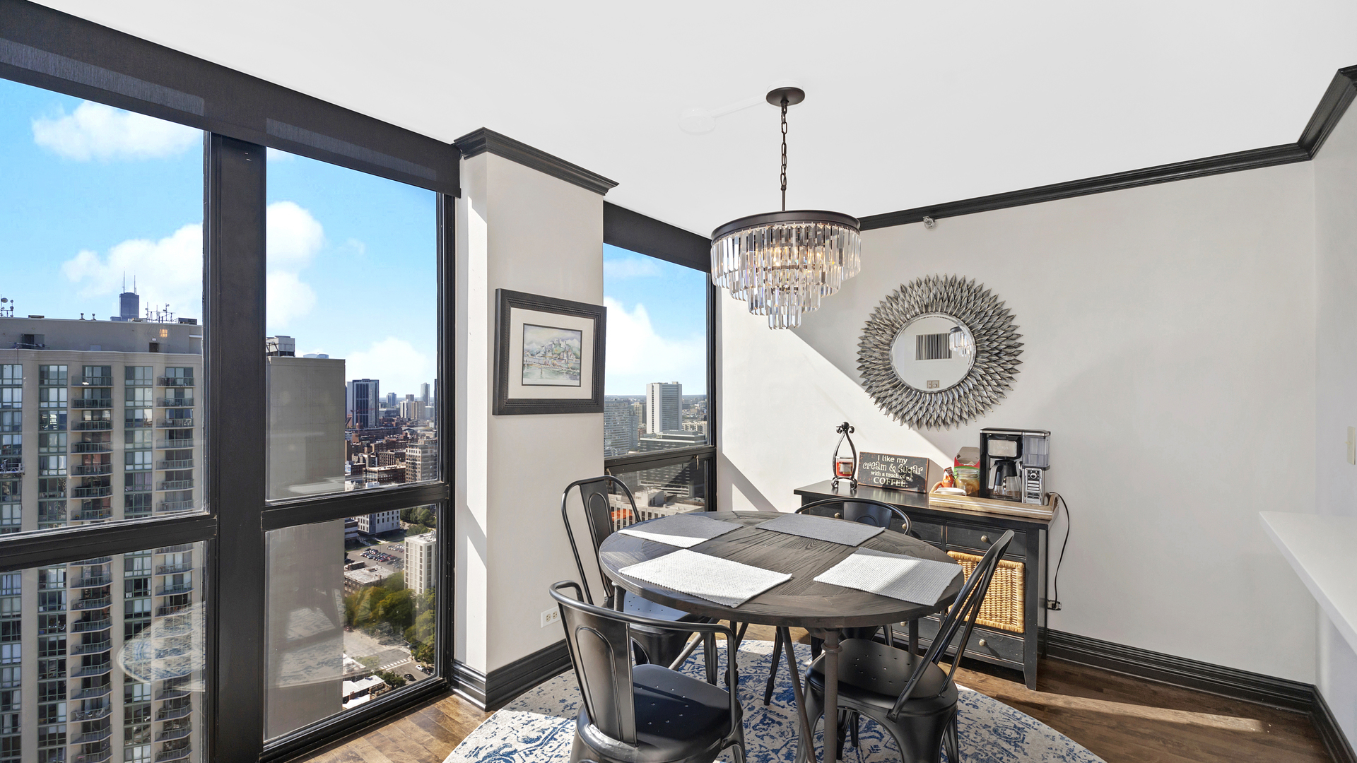 1122 North Clark Street, Unit 3808 Chicago, IL 60610 - Photo 8 of 29 a view of a dining room with furniture window and wooden floor