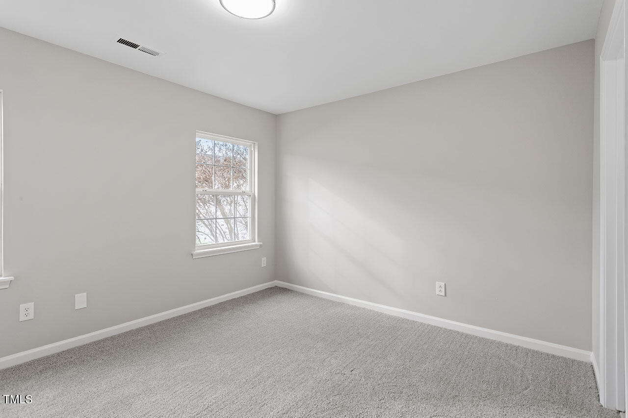 5340 Big Bass Drive Raleigh, NC 27610 - Photo 12 of 20 an empty room with a window