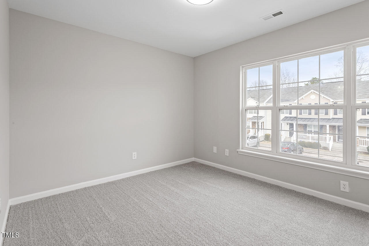 5340 Big Bass Drive Raleigh, NC 27610 - Photo 17 of 20 an empty room with windows