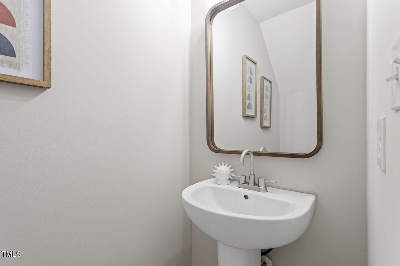5340 Big Bass Drive Raleigh, NC 27610 - Photo 6 of 20 a bathroom with a sink and a mirror