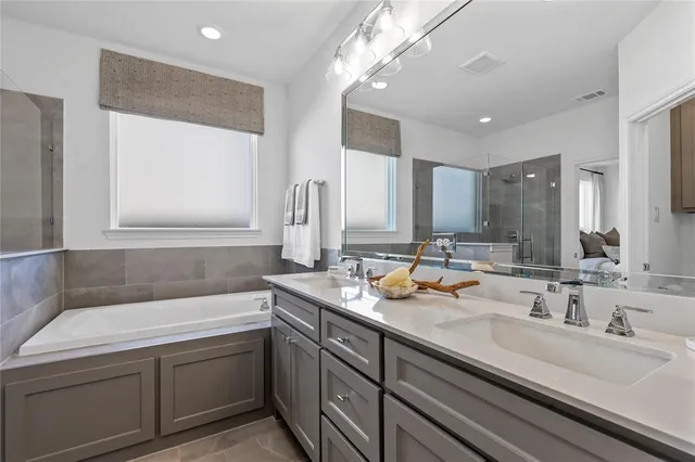 a bedroom with a bed and cabinet