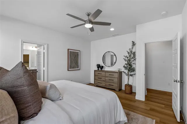 a bathroom with a two sinks a large mirror and a bathtub