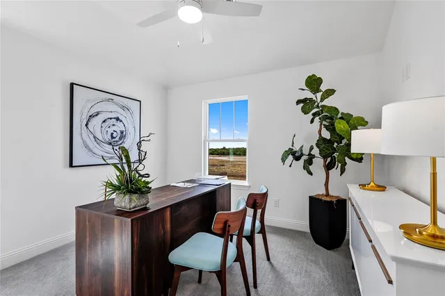 a view of a workspace with furniture