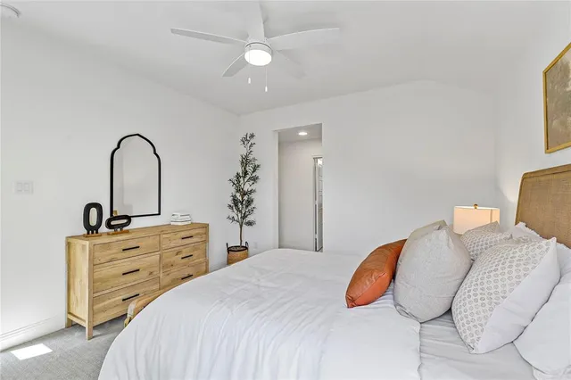 a bedroom with a bed and a dresser