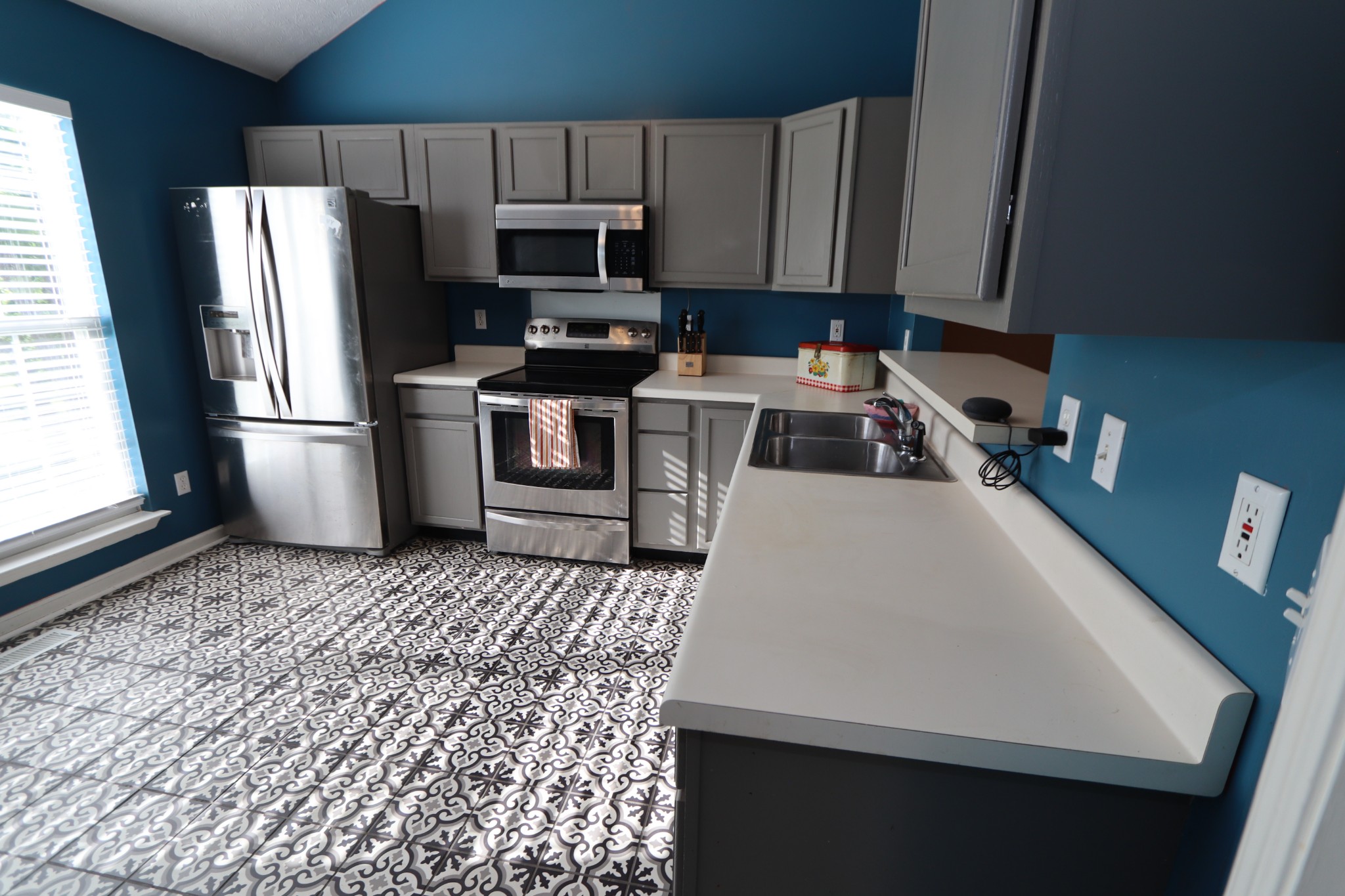 7523 Chester Road Fairview, TN 37062 - Photo 15 of 53 a kitchen with a sink a microwave a refrigerator and cabinets