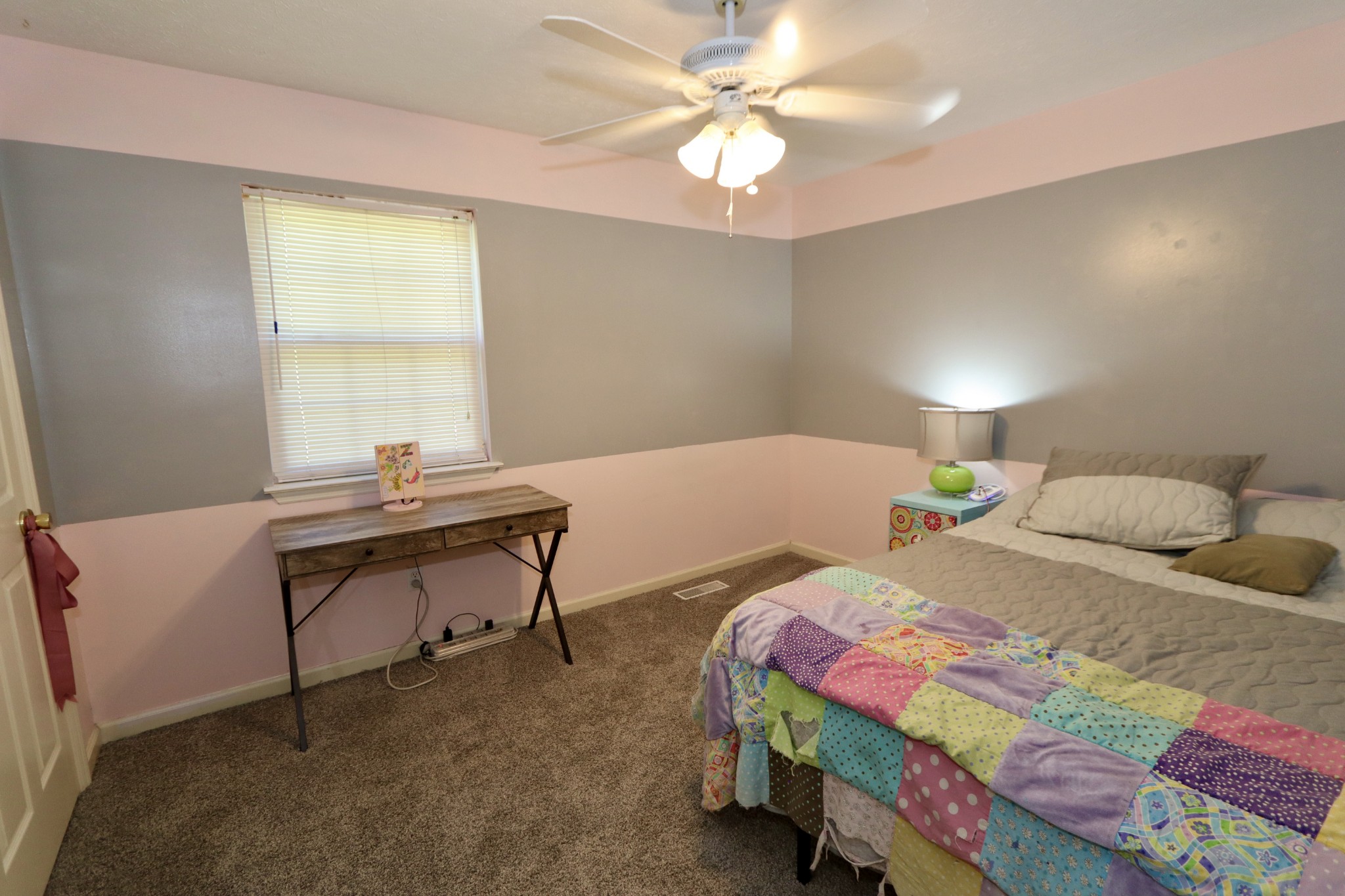 7523 Chester Road Fairview, TN 37062 - Photo 31 of 53 a bedroom with a bed and a chandelier