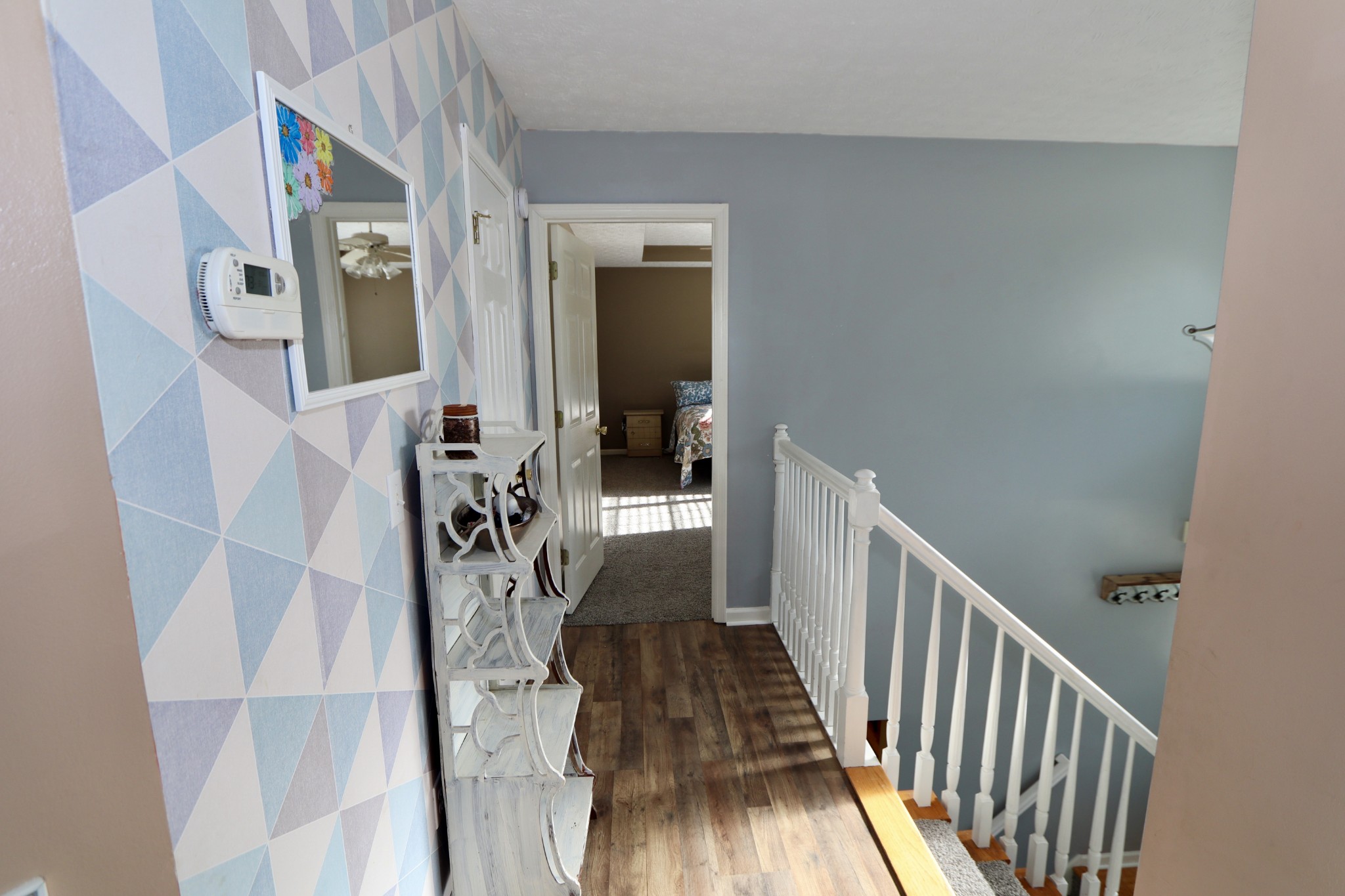7523 Chester Road Fairview, TN 37062 - Photo 8 of 53 a view of a hallway with wooden floor and entryway