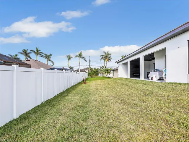a view of a porch with table and chairs