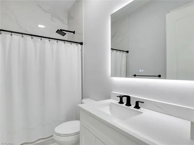 a bedroom with a bed and a cabinets