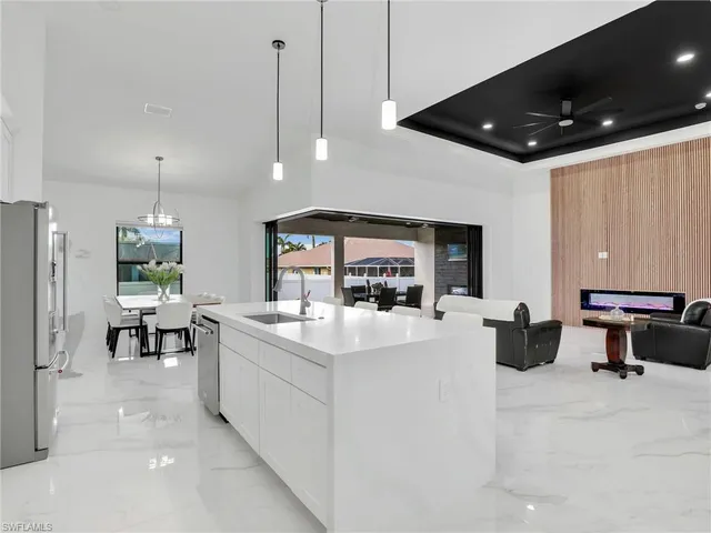 a utility room with cabinets washer and dryer