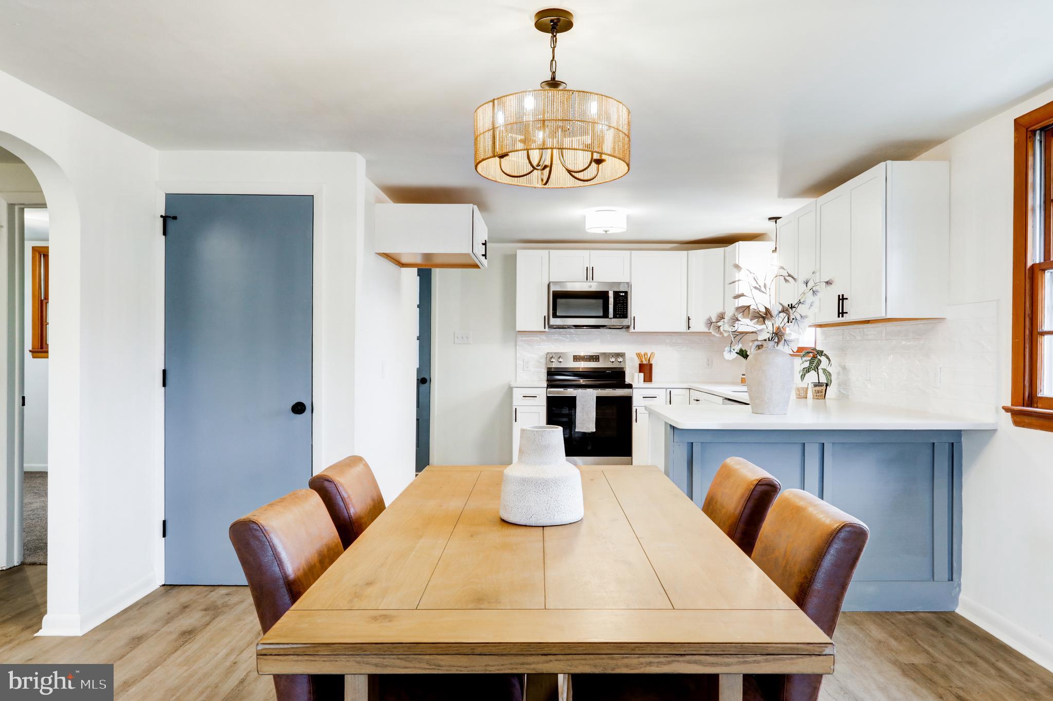6428 York Road Spring Grove, PA 17362 - Photo 15 of 47 a kitchen with stainless steel appliances kitchen island granite countertop a kitchen island and chairs in it