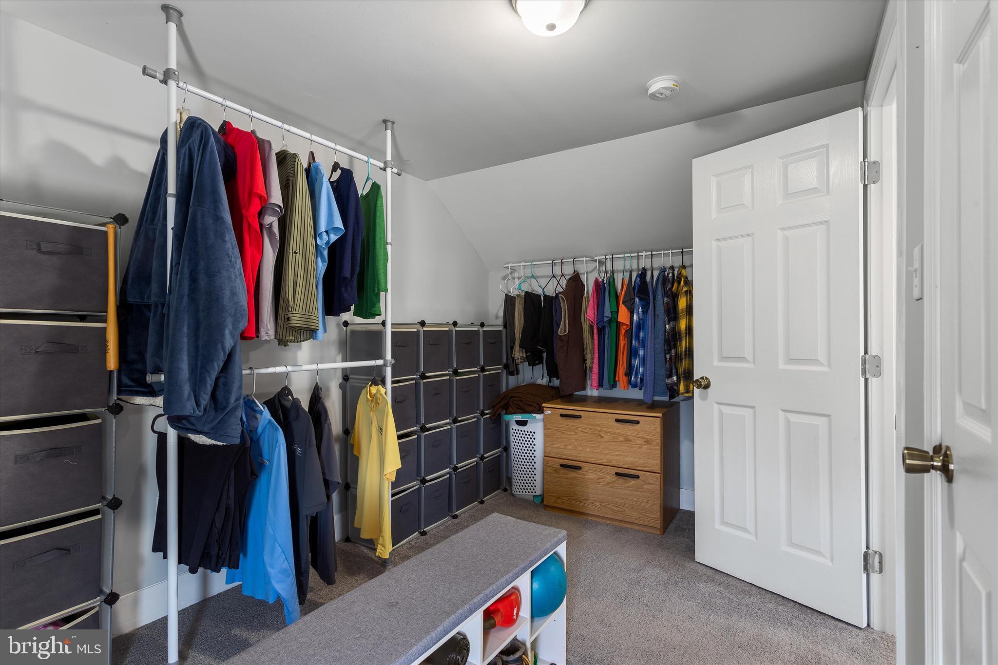 337 Old Charles Town Road Stephenson, VA 22656 - Photo 19 of 27 a view of walk in closet with clothes and shoes