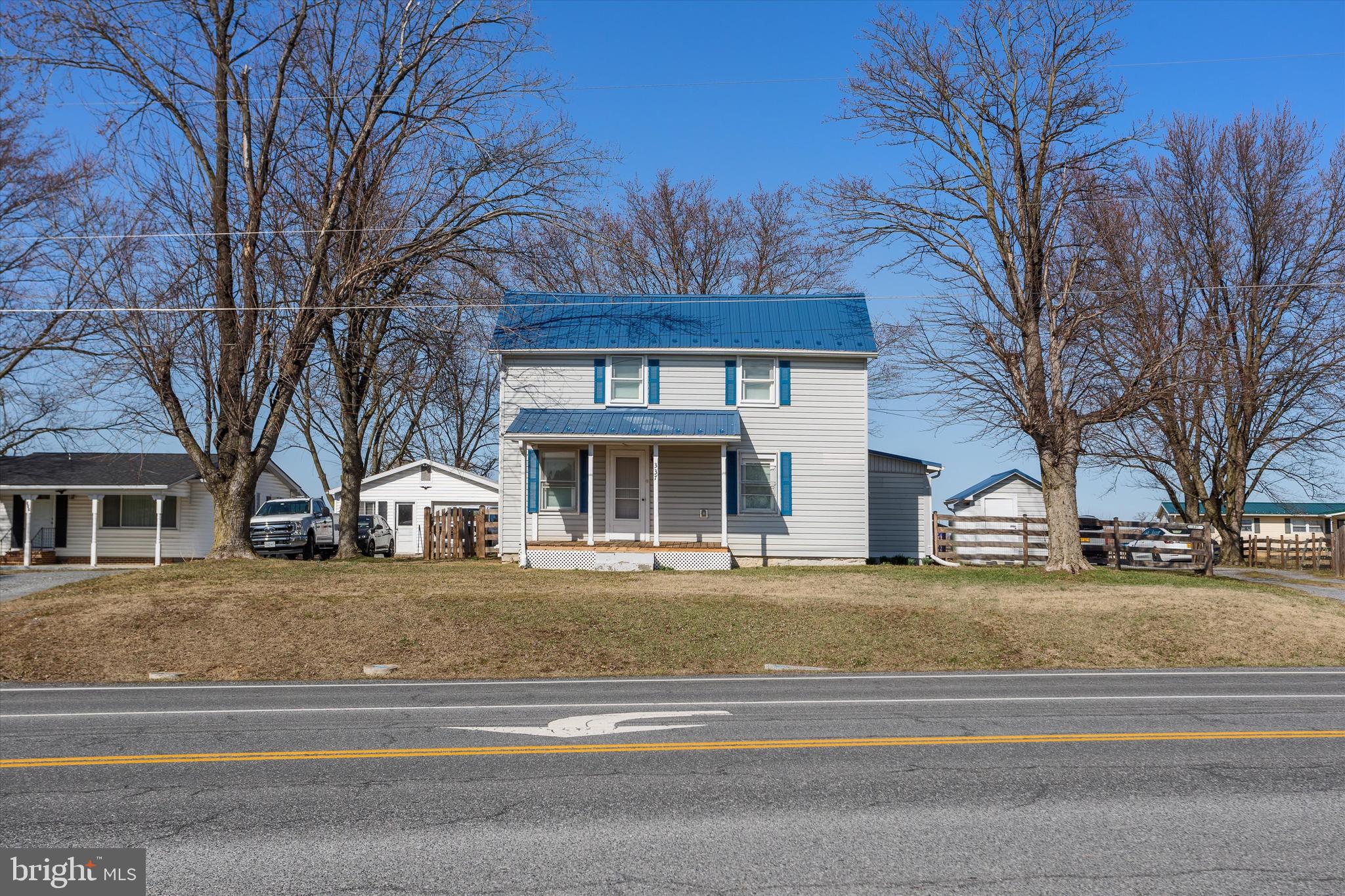 337 Old Charles Town Road Stephenson, VA 22656 - Photo 4 of 27 a front view of residential houses with yard and trees
